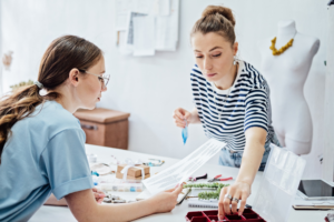 Jewelry small business, jewelry workshop. Two female professional jewelry designers making handmade