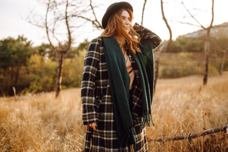 Stylish woman enjoying autumn weather in the park. Fashion, style concept. People, lifestyle.